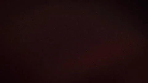 Abstract dark brown grainy texture background with subtle red shades blur g.. Stock Photos