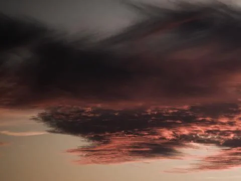 Abstract dark cloud texture with atmospheric sunset tones Stock Photos