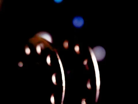 Abstract dark composition with glowing crescent shapes against a hazy, grad.. Stock Photos