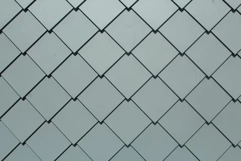 Abstract Dark Diagonal Wire Mesh Grid on Light Grey Glass Texture Background Stock Photos