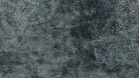 Abstract dark gray fabric texture with wavy patterns and soft depth for minim Stock Photos