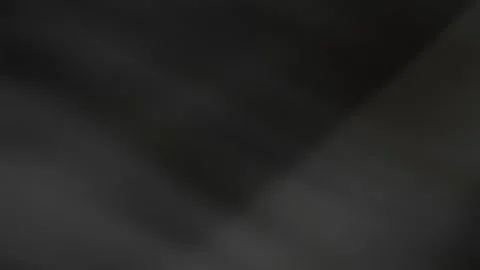 Abstract dark gray flowing fabric texture with subtle light reflections on trans Stock Footage 329183531