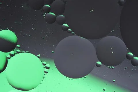 Abstract dark gray green background with oil circles water surface. Stock Illustration