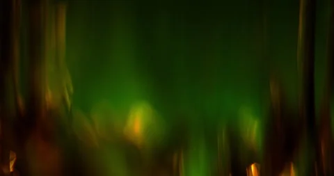 Abstract Dark Green Background with Moving Lens Flares and Anamorphic Bokeh Stock Footage 340482176