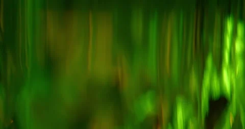 Abstract Dark Green Background with Moving Lens Flares and Anamorphic Bokeh Stock Footage 341339053
