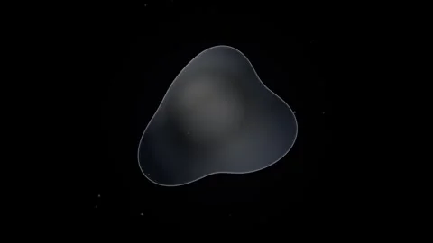 Abstract dark liquid drop morphing in empty black space with subtle glowing.. Video stock 344905815