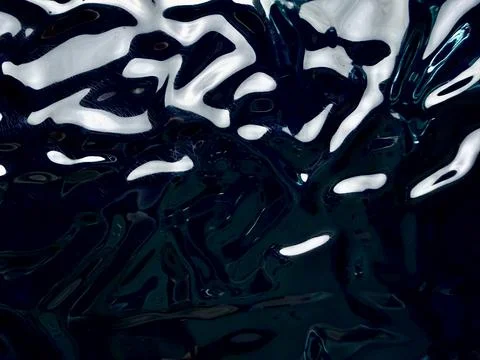 Abstract dark navy blue liquid ripples distorting bright white light macro .. Stock Photos