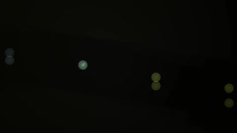 Abstract dark night scene with glowing green and yellow indicator lights sh.. Stock Footage 346322209