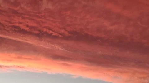 Abstract dark red background. Dramatic red sky. Red sunset with clouds Foto stock