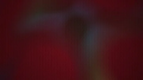 Abstract Dark Red Background with Shifting Soft Light Leaks and Grain Texture Stock Footage 344714879
