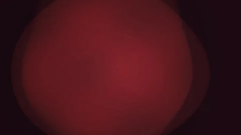 Abstract dark red lens flare light leak and subtle glowing bokeh effect on .. Stock Footage 346323112