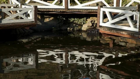 Abstract dark water surface with reflections. Wave and ripple on dark surface Stockbeeldmateriaal 104060267