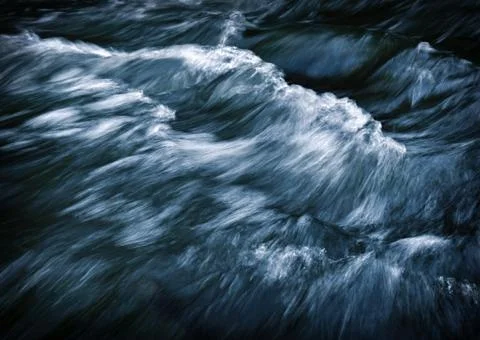 Abstract dark waves on the river Stock Photos