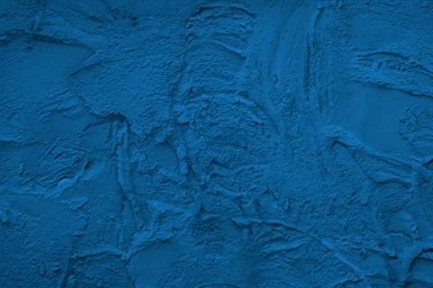 Abstract decorative dark blue plaster wall background Stock Photos