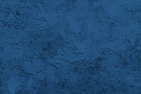 Abstract decorative dark blue plaster wall background Stock Photos