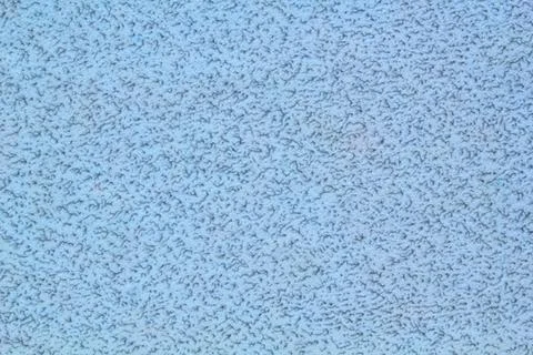 Abstract decorative texture of a grey wall covering interspersed Stock Photos