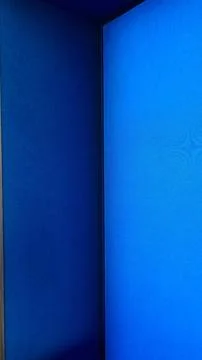 Abstract deep blue architectural corner with light gradient. Stock Photos