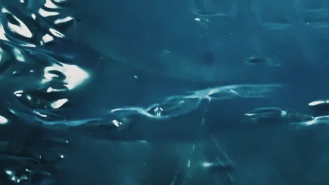 Abstract deep blue liquid surface with light reflections Stock-Footage 340580922