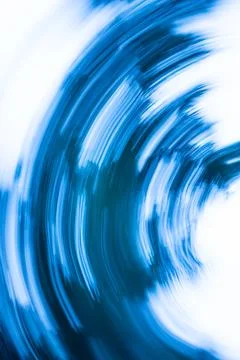 Abstract defocused backplate features deep blues, shadowy gradients, and gl.. Stock Photos