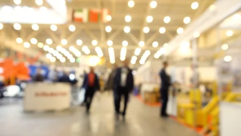 Abstract Defocused Blurred Background flow of many people inside space shopping  Stock Footage 98687918