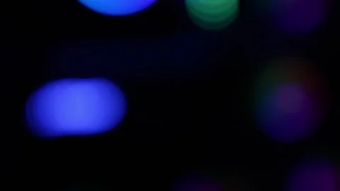 Abstract defocused bokeh lights in blue and purple on dark background, crea.. 库存影片 334285536