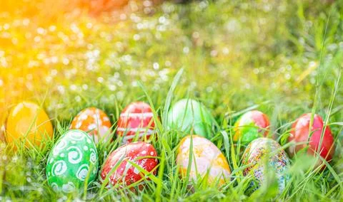 Abstract Defocused Easter, Closeup, many beautiful painted eggs as grass bl.. Stock Photos