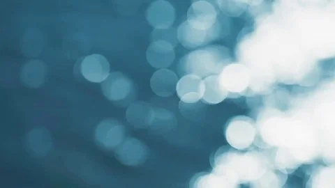 Abstract defocused water flow with reflection of sunlight with bokeh Stock Footage 74547764