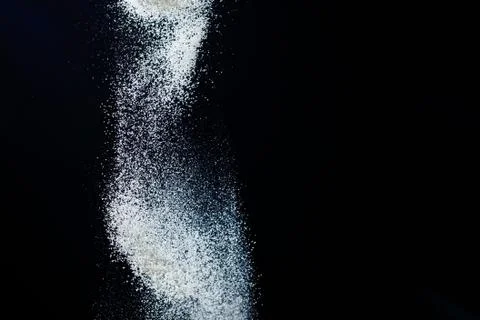Abstract design of white powder cloud isolated on black, dark background. Abs Photos