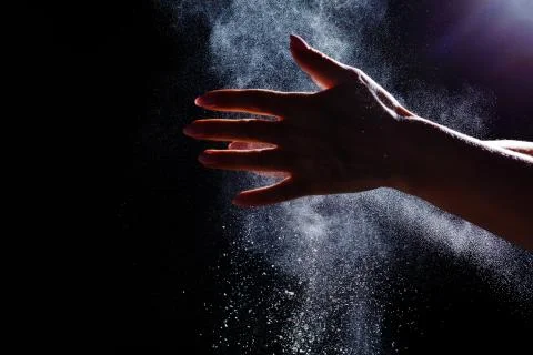 Abstract design of white powder cloud isolated on black, dark background. Abs Photos