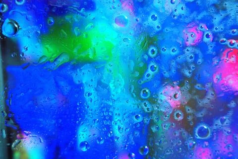 Abstract desktop wallpaper featuring water or oil droplets on a colored bac.. Stock Photos