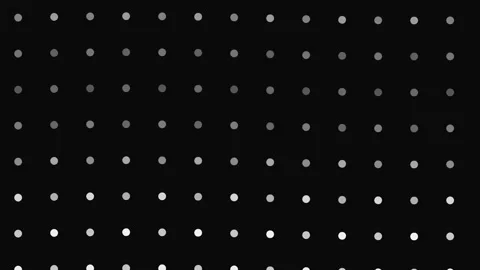 Abstract digital grid displaying pulsing white dots against solid black Stock Footage 345315547