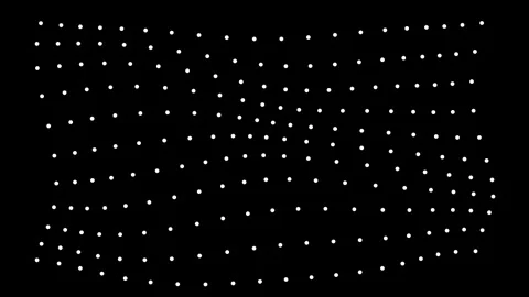 Abstract digital grid of white dots moving with a subtle wave effect on a d.. Video stock 345545799