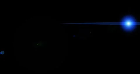 Abstract digital lens flare in black background. Beautiful flare warm natural li Stock Footage 336264368