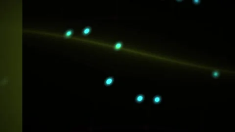 Abstract digital motion background featuring glowing blue particles moving .. Stock Footage 340505457