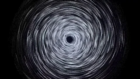 Abstract digital spiral vortex in black and white spinning rapidly on a dar.. Stock Footage 345896550