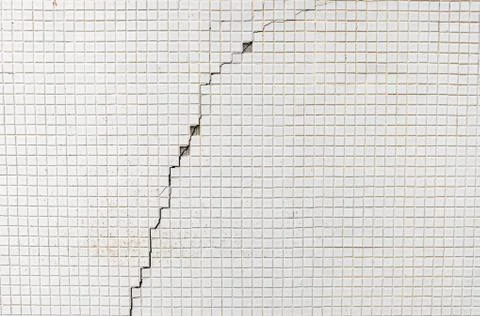 Abstract dirty old tile on an outer wall of a building concrete tile crack wa Stock Photos
