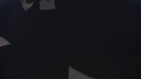 Abstract Documents Falling Through the Darkness in Slow Motion Video stock 210220958