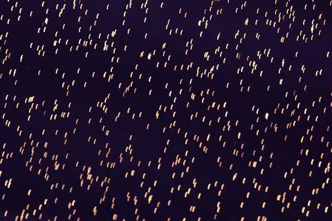 Abstract Dots on Dark Background. Dark purple background with gold dots. Fabric Stock Photos