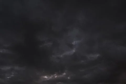 Abstract, dramatic background dark storm clouds. Stock Photos