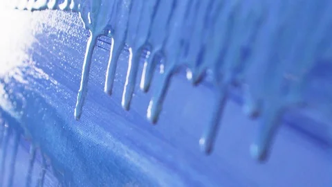 Abstract drawing of blue paint, dripping drops close-up video Stock Footage 89691221