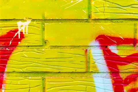 Abstract drawing on a brick wall background. Stock Photos