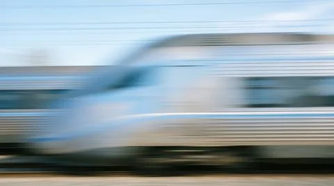 Abstract dynamic horizontal motion blur showing modern silver high speed pa.. Stock Photos