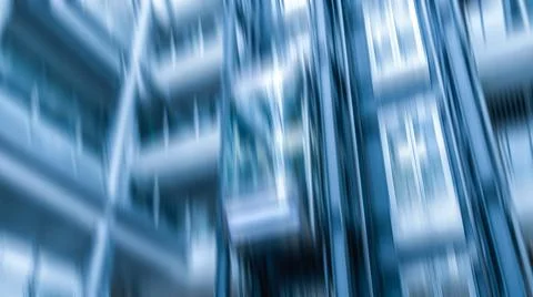 Abstract dynamic vertical motion blur showing modern corporate glass buildi.. Stock Photos