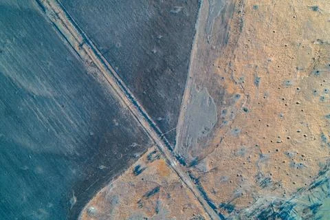 Abstract earth texture with brown soil and dry grass pattern illustrating Foto stock
