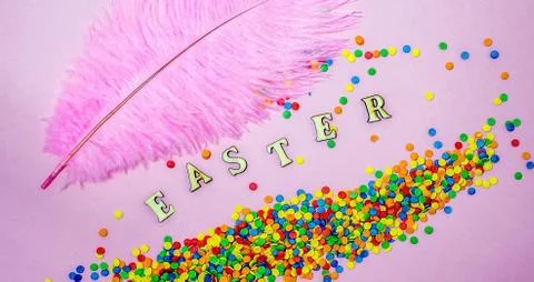 Abstract easter card with scattered color confectionery balls and letters 스톡 사진