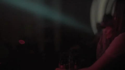 Abstract Eccentric lights in a nightclub. Anonymous people dancing. Stock Footage 148282929