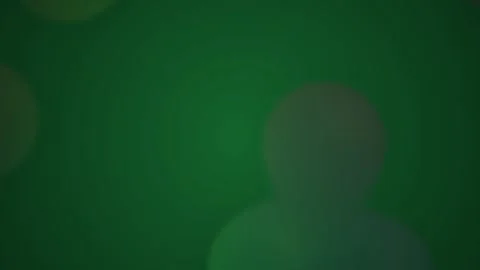 Abstract emerald green bokeh light leaks floating gently on a dark background Stock Footage 346327043