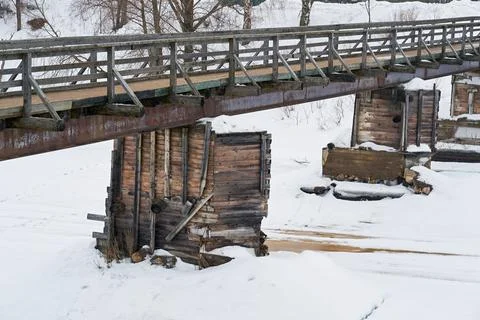 Abstract empty old wooden bridge closeup on the river in a vintage photo Stock Photos
