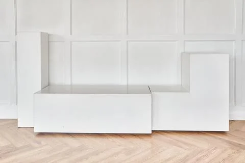 An abstract empty white podium on a light background. The layout of the stand Stock Photos