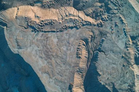 Abstract erosion texture of clay soil with intricate rill patterns, aerial top Stock Photos